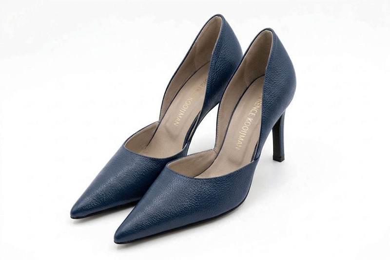 Sophisticated d'Orsay pumps with an open arch cut, designed to elongate the leg with effortless grace, in denim blue leather with pointed toe and high slim heel